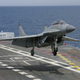 Illustration for article titled Taking Off In A MiG-29K From A Carrier At Night Is A Fiery Thrill